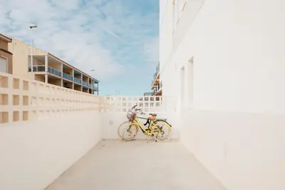 a bike parked on the side of a building at Terrasses - Beach apartment with swimming pool in Puzol