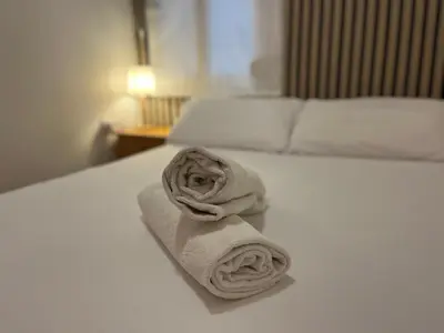 a towel on a bed in a hotel room at BajoPlaya in Burriana