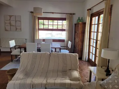 a living room with a couch and a table at La Casa del Sol in La Eliana