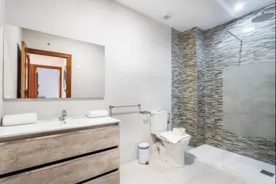 a bathroom with a toilet and a sink and a shower at Centrico, 2 habitaciones, confort ascensor,wifi AC in Valencia