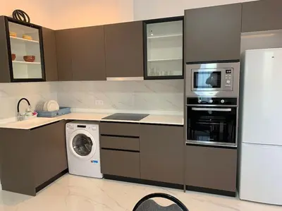 a kitchen with a refrigerator and a washer and dryer at Apartamento Sara - Alquiler de temporada in Puerto de Sagunto