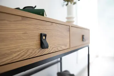 a wooden dresser with a black remote control on it at SingularStays Santa Clara II in Valencia