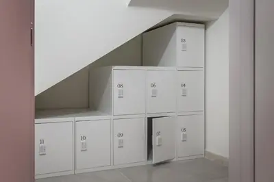 a row of white lockers in a room at BYPILLOW Sinfonía in Valencia