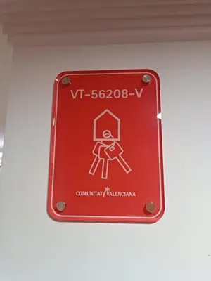 a red sign on a wall with a person on it at Gilet senderismo bici parking 20 min Valencia in Gilet