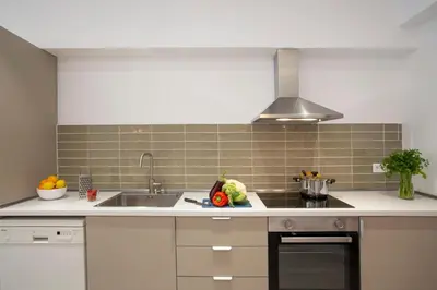 a kitchen with a sink and a counter top at SingularStays Casa del Grao in Valencia