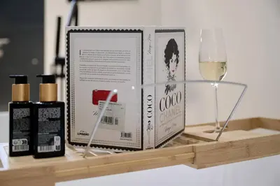 a shelf with a bottle of wine and a glass at Romantic Apartment N2 Oceanografico Virkin Suites in Valencia