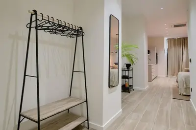 a room with a mirror and a wooden shelf at Romantic Apartment N6 Oceanografico Virkin Suites in Valencia
