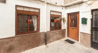 a building with two windows and a door at Loft bajo vivienda centro de Valencia-Carmen in Valencia