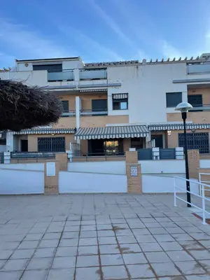 a large white building with a patio in front of it at Valencia Sun House in Puebla de Farnals