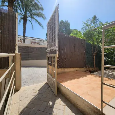a wooden gate with a fence on a patio at MD Malva Valterna in Paterna