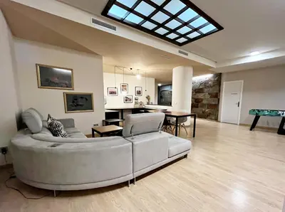 a living room with a couch and a table at Apartamento junto Mercado Central Valencia in Valencia
