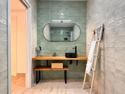 a bathroom with a sink and a mirror at Alberola Industrial Style in Valencia