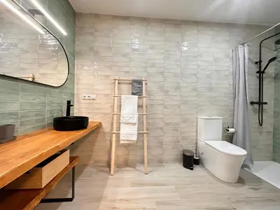 a bathroom with a toilet and a shower at Alberola Industrial Style in Valencia