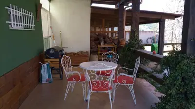 a table and four chairs on a patio at La Traviesa in Soneja