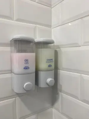 a wall with two containers of candles on it at ALZIRA BONiTA LES BARRAQUES LOFT in Alzira