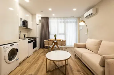 a living room with a couch and a table at Cortes Suites by Concept Flats in Valencia