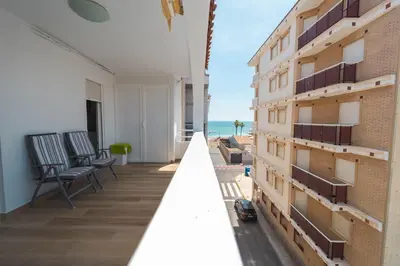 a view of the beach from the balcony of a building at Apartamento acogedor en la Playa de Nules in Nules