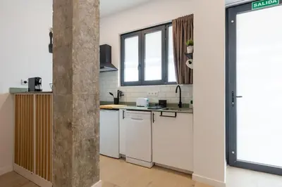 a kitchen with white appliances and a window at Loft nuevo cerca de Ruzafa y Ciudad de las Artes in Valencia