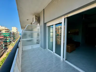 a balcony with a view of a building at Cullera Beach Oasis in Cullera