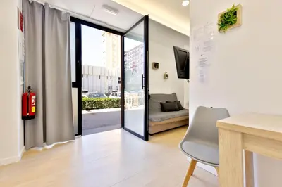 a living room with a sliding glass door at Apartamento RD A in Valencia