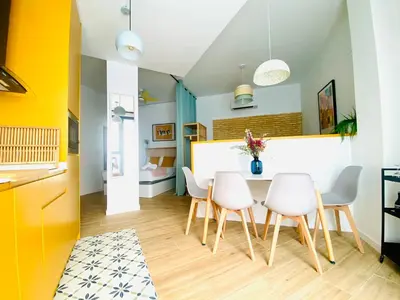 a kitchen and dining room with a table and chairs at BAJO B - Design & Comfort in Ruzafa SOHO in Valencia