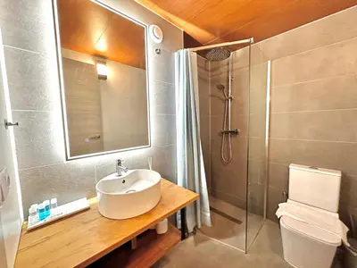 a bathroom with a sink and a shower at Place Your Place SUITES Benimaclet in Valencia
