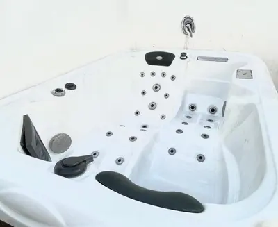 a white bath tub with a faucet at ESTUDIO CON JACCUZI Y SAUNA montaña y playa in Tavernes de Valldigna