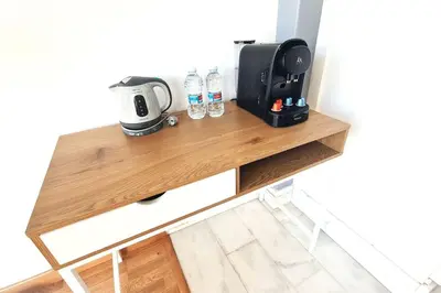 a table with a coffee maker and glasses on it at E-Arenas Apartment with terrace in Edificio Arenas in Valencia