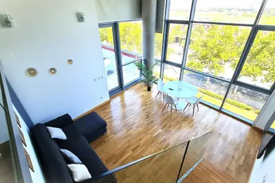a living room with a couch and a table at E-Arenas Apartment with terrace in Edificio Arenas in Valencia