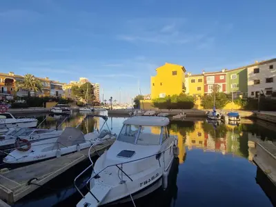 a group of boats are docked at a marina at Port Saplaya 2 habitaciones Valencia in Port Saplaya