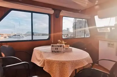 a table in a room with a window at Barco muy espacioso con dos terrazas Valencia CENTRO!! in Valencia