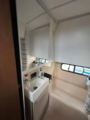a small bathroom with a sink and a mirror at Barco muy espacioso con dos terrazas Valencia CENTRO!! in Valencia