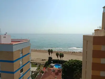 a view of the beach from a building at Luminoso estudio con vistas al mar in Las Canteras