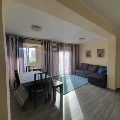 a living room with a table and a couch at Apartamento Berenguer in Cullera