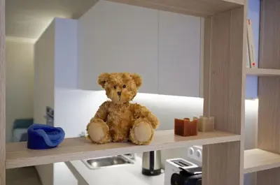 a teddy bear sitting on top of a shelf at Osito Hub - Justo y Pastor in Valencia