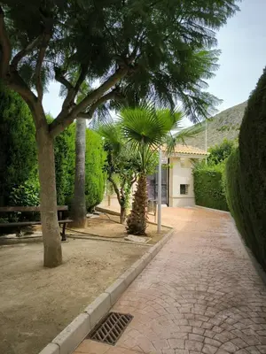 a park with trees and a brick walk way at Apartamento Masia Racó Cullera in Cullera