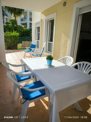 a white table and chairs on a patio at Apartamento Masia Racó Cullera in Cullera