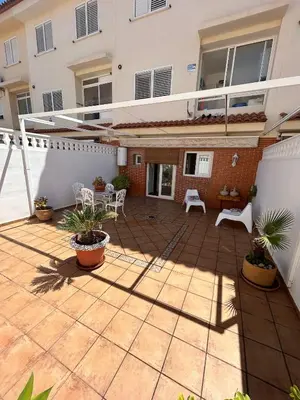 a patio of a house with plants on it at vivienda independiente in Canet de Berenguer