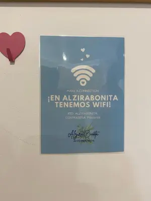 a sign hanging on a wall with a heart at ALZIRA BONiTA SUITE ViP jacuzzi in Alzira