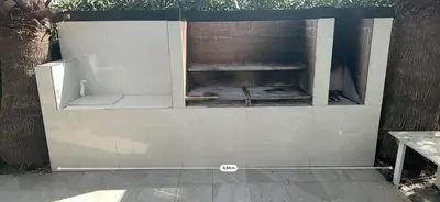 a brick wall with an outdoor oven in it at Palm Garden Valencia in Bétera