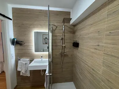 a bathroom with a shower and a sink at Studio 1 Port Valencia in Valencia