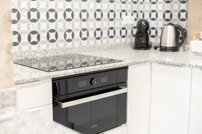a kitchen with a sink and a stove at NEW Beach Flats Valencia 3 in Valencia