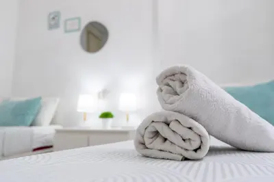 a towel sitting on top of a bed at Habitación Maritim 1 in Valencia