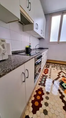 a kitchen with a patterned floor in a kitchen at Habitación Maritim 2 in Valencia