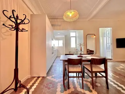 a kitchen and dining room with a table and chairs at Stylish Ruzafa Market in Valencia