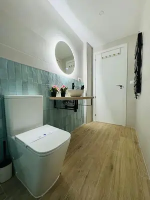 a bathroom with a white toilet and a sink at New Industrial Design Flat in Russafa SOHO in Valencia