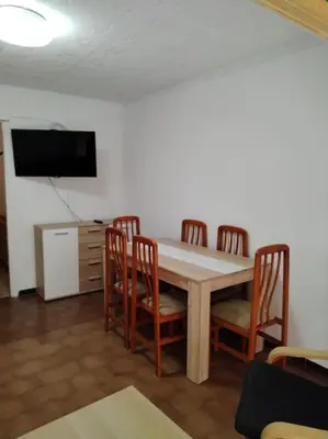 a kitchen with a sink and a stove and cabinets at Apartamento con parking frente a la playa in Faro de Cullera