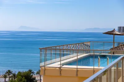 a view of the ocean from the balcony of a hotel at Sea View Terrace Apartment Cullera in Cullera