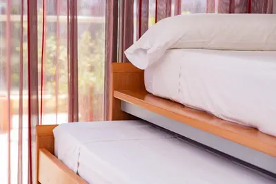 a bedroom with two bunk beds and a window at Sea View Terrace Apartment Cullera in Cullera