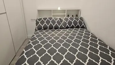 a small bedroom with a bed in a room at Loft Canet in Canet de Berenguer
